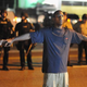 A protester joins hands with community leaders during a peaceful protest in Ferguson, Mo., Aug. 20, 2014.
Michael B. Thomas/AFP/Getty Images